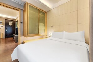 Desk, laptop workspace, blackout curtains, iron/ironing board - Uhome Apartments (Shenzhen)