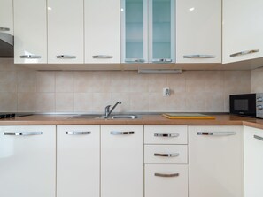 Fridge, microwave, oven, cookware/dishes/utensils