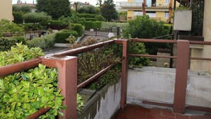 A residential area with a balcony, a concrete wall, and a metal railing. - La Casara B by Interhome (Lazise)
