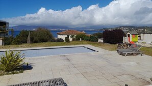 A pool area with a view of the sea and mountains. - House Pietrosella Sea view 50 m from the beach (Pietrosella)