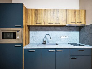 Microwave, dishwasher, dining tables