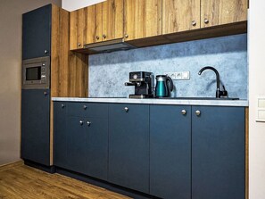 Microwave, dishwasher, dining tables