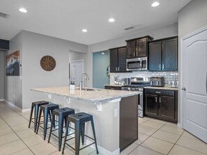 Fridge, microwave, oven, stovetop - Solterra Resort Villa! Pool, Theater, Game Room (Davenport)