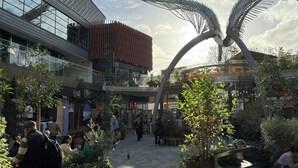 A modern building with a unique architectural design, featuring a prominent metal sculpture in the center. - Private En-Suite Room | Walk to Angel Station | Near Shoreditch (London)