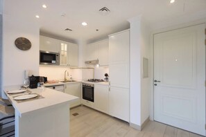 Fridge, microwave, toaster, cookware/dishes/utensils