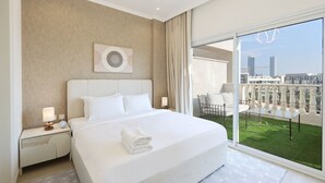 A modern hotel room with a large bed, a city view balcony, and a minimalist decor.