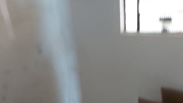 A room with tiled flooring, a window, and a cardboard box. - Hospedagem  (Sao Gabriel)