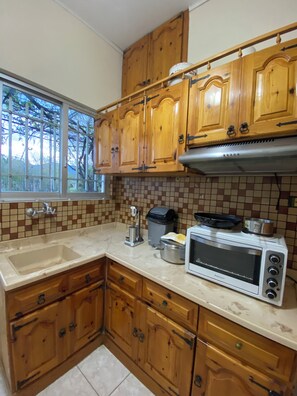 Fridge, oven, coffee/tea maker, cookware/dishes/utensils