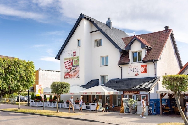 A two-story building with a restaurant on the ground floor.