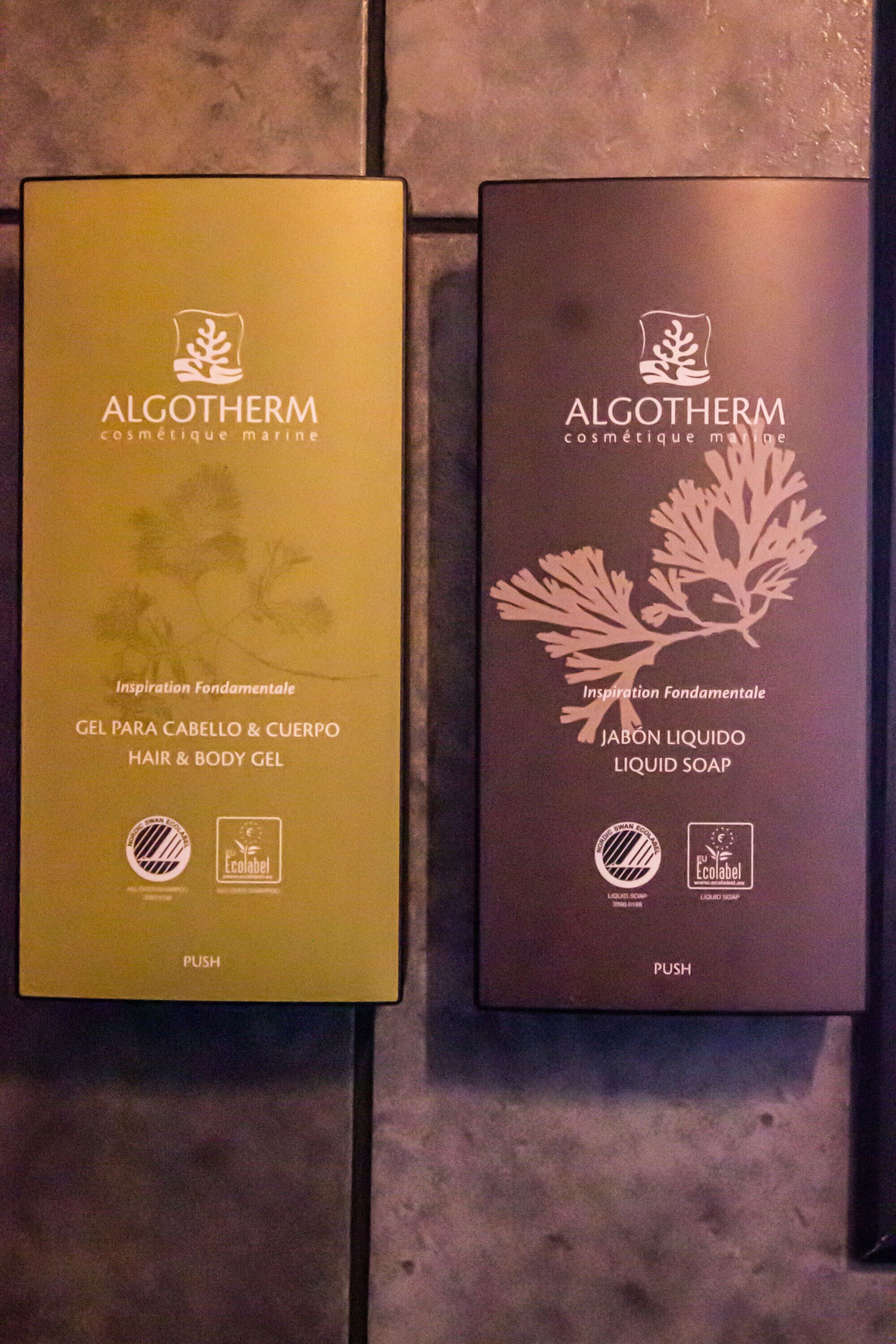 Two boxes of Algotherm products, one labeled 'Hair & Body Gel' and the other 'Liquid Soap', both with a 'PUSH' instruction.