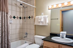Jetted tub, hair dryer, towels, soap