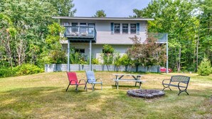 A house with a deck, a fire pit, and outdoor seating. - DePerrys On The Lake Waterfront Access to Lake Superior (Bayfield)