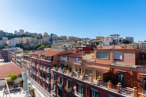 A row of terraced buildings with balconies, some with plants. - NA Bella Vista Rooftop-B&B  (Naples)