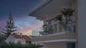 A modern house with a balcony, a clear sky, and a tree. - One bedroom and one living room apartments in Estoril Beach Villas (Estoril)