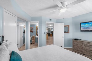 A bedroom with a bed, a ceiling fan, a TV, and a dresser. - Seashells By The Seashore at Seaside Beach & Racquet - Free Daily Activities! (Orange Beach)