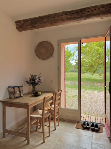 Provençal farm among olive trees; view of the hill from a large shaded terrace