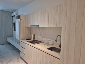 Fridge, microwave, stovetop, coffee/tea maker