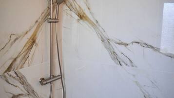 Superior Double Room, Balcony, City View | Bathroom | Shower, hair dryer, slippers, towels