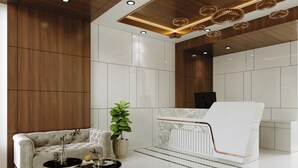 A modern lobby with a sofa, coffee table, and potted plant. - Aurea by The Wallflower Hotels (Kota)