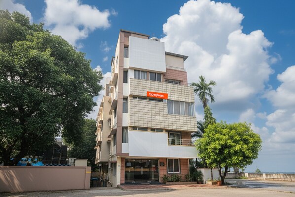A multi-story building with a sign reading "fabexpress" on the facade. - Fabexpress Star Light (Pune)