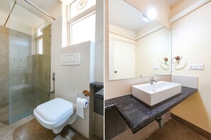 Habitación Deluxe | Baño | Regadera, regadera tipo lluvia, amenidades de baño gratuitas, toallas