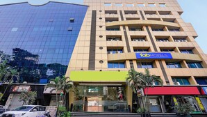 A multi-story building with a modern design, featuring a prominent 'Fab Hotels' sign on the facade. - Fabhotel Shiv Leela Grand (Mumbai)