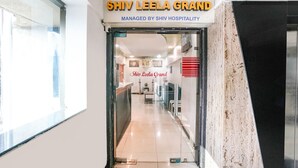The entrance to Shiv Leela Grand Hotel with a clear view of the reception area and a sign indicating it is managed by Shiv Hospitality. - Fabhotel Shiv Leela Grand (Mumbai)