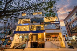 A hotel with a ground floor featuring an ATM and a staircase leading to the upper floors. - Fabhotel Green Vista (Bangalore)