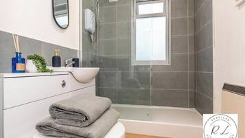 Shower, hair dryer, towels