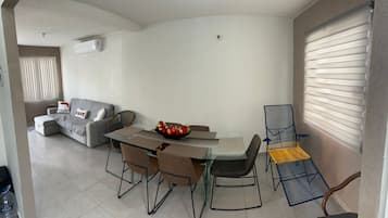 Basic Apartment, Patio, Pool View | Living area | Flat-screen TV