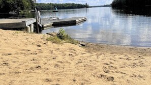 Enjoy serene lake views from the dock with a safe platform and metal railing.