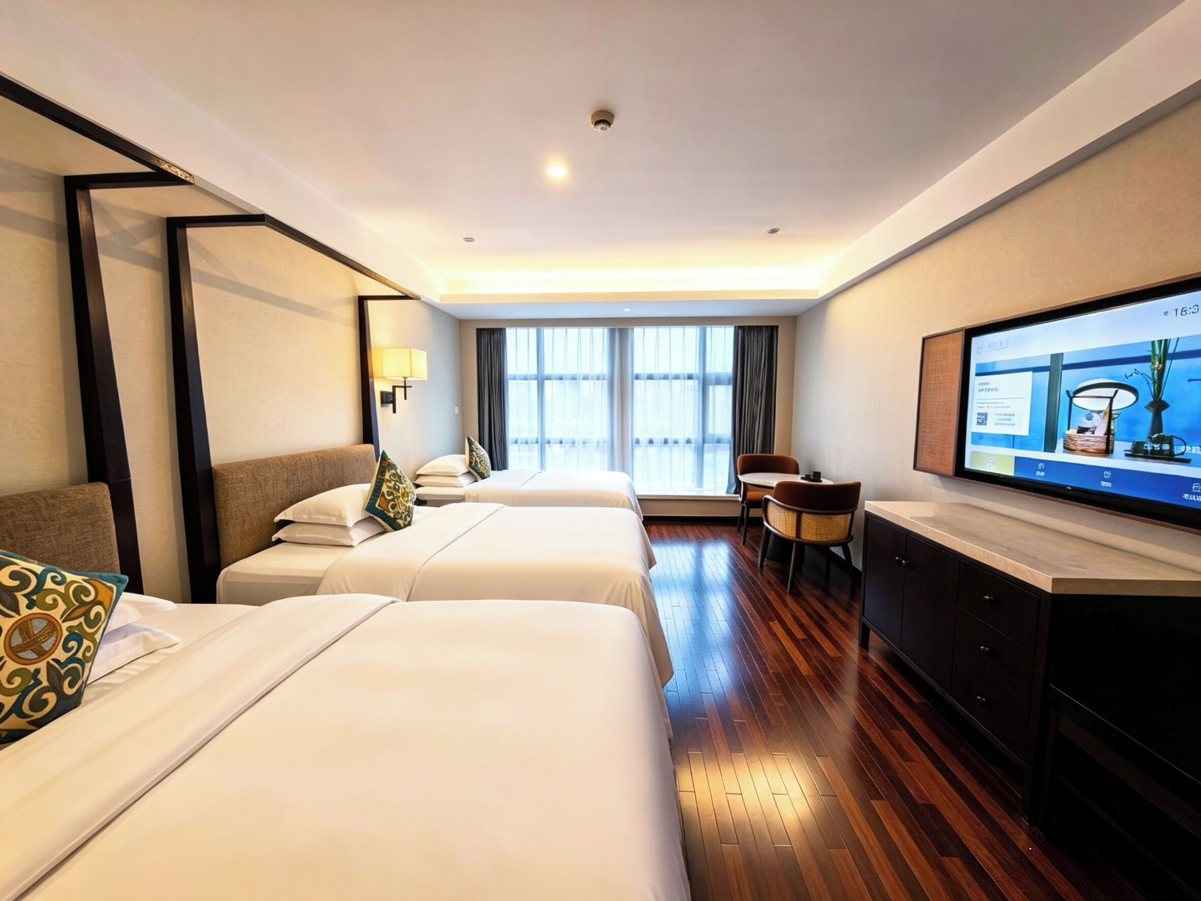 Family Quadruple Room, City View | Free minibar, in-room safe, individually decorated, laptop workspace