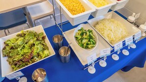 A buffet table with various food options including salads, corn, broccoli, and shredded cheese. - Toyoko Inn Kobe Sannomiya Ekimae (Kobe)
