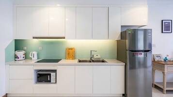 Luxury Apartment, Balcony, City View | Private kitchen | Full-size fridge, microwave, cookware/dishes/utensils