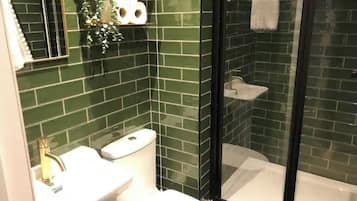 Shower, hair dryer, towels, toilet paper