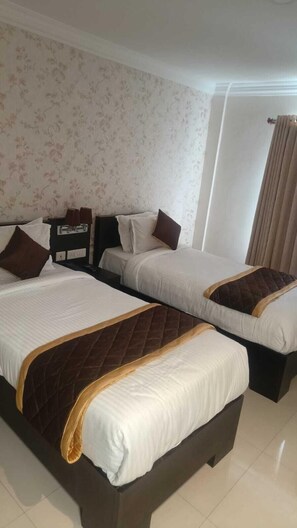 Deluxe Double or Twin Room, City View | In-room safe, blackout curtains, iron/ironing board, free WiFi - Hotel Grand Regency (Aluva)