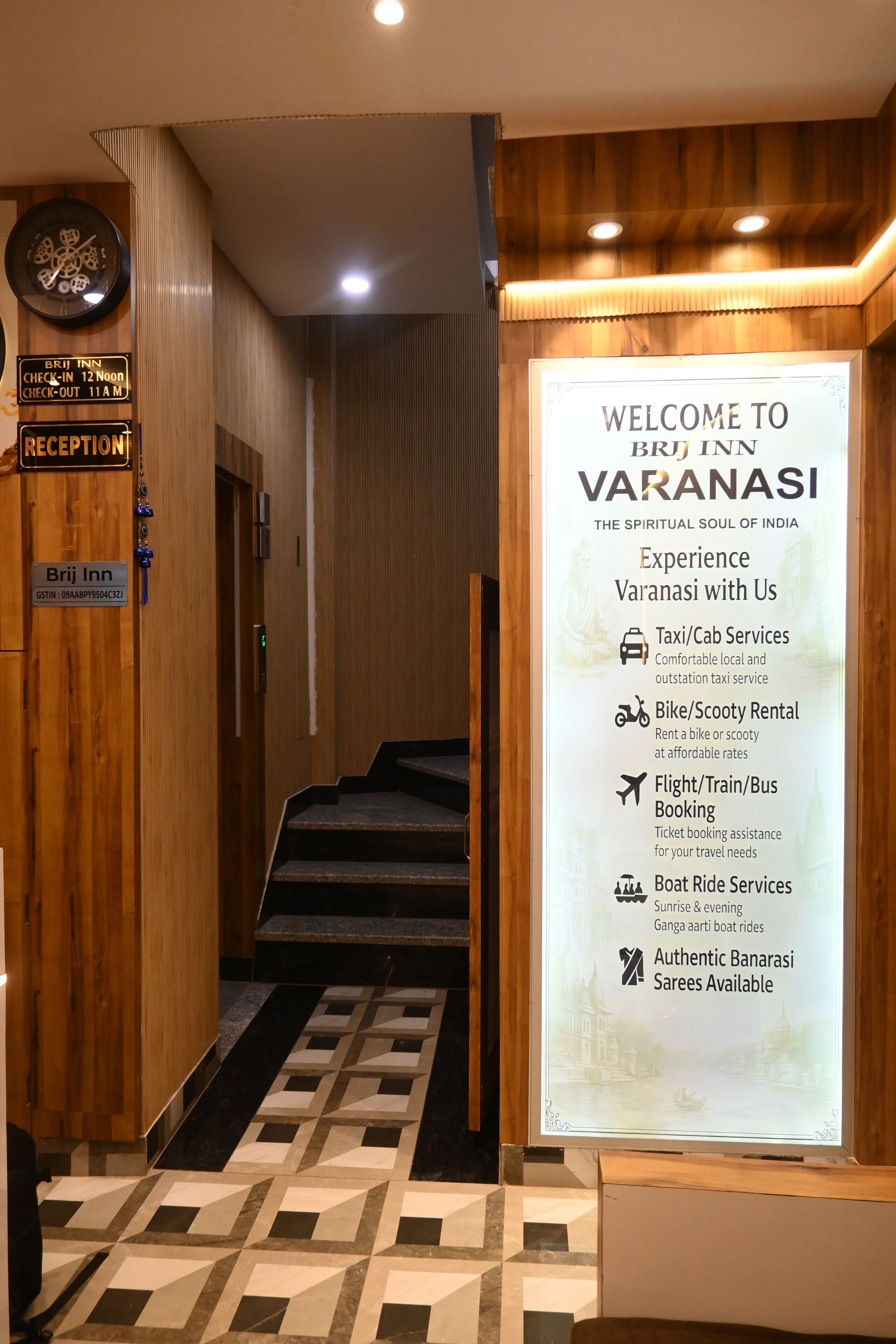 A reception area with a signboard detailing services like taxi, bike rental, and boat rides.