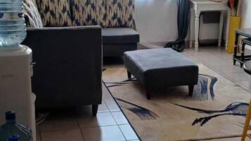 Family Apartment, City View | Living area | Smart TV