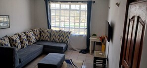 Family Apartment, City View | Living area | Smart TV - Lux Suites zahara Gardens Apartments (Nairobi)
