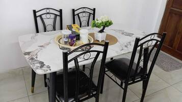 Family Apartment, Balcony, City View | In-room dining