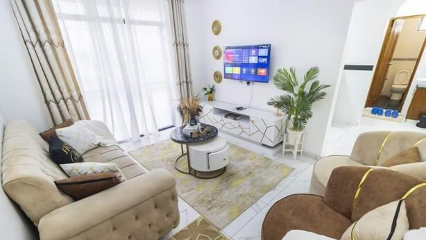 Classic Apartment, Balcony | Living area | 24-inch Smart TV with digital channels - Lux Suites Rosavosa Apartments Bamburi (Mombasa)