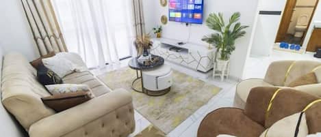 Classic Apartment, Balcony | Living area | 24-inch Smart TV with digital channels
