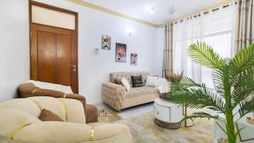 Classic Apartment, Balcony | Living area | 24-inch Smart TV with digital channels