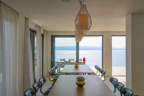 Enjoy meals with a breathtaking view of the water from this spacious dining area.