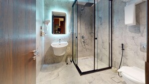 Designer toiletries, hair dryer, slippers, bidet