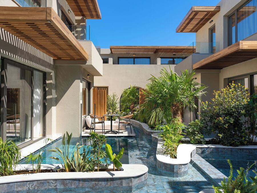 Seasonal outdoor pool, open 10:00 AM to 7:00 PM, pool umbrellas