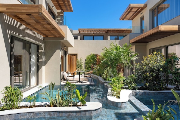 Seasonal outdoor pool, open 10:00 AM to 7:00 PM, pool umbrellas