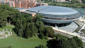 A stadium with a large central field and surrounding seating, surrounded by trees and a body of water. - Le Masséna d'Or: Quiet, Metro + Parc Tête D'or (Lyon)