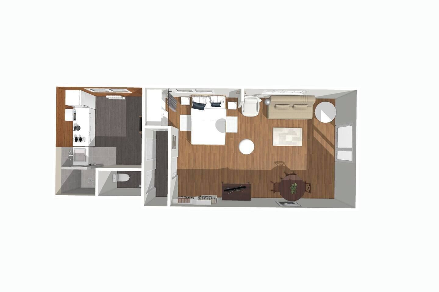 A modern interior with a kitchen, dining area, and living room.