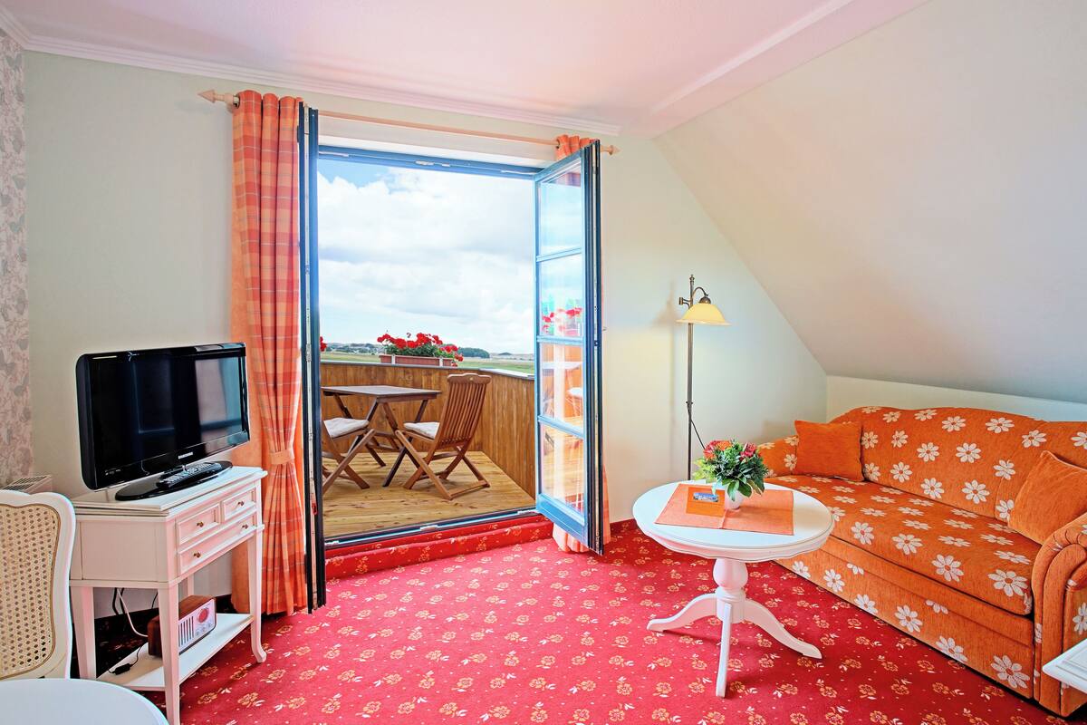 Comfort suite, balkon, uitzicht op meer | Woonruimte
